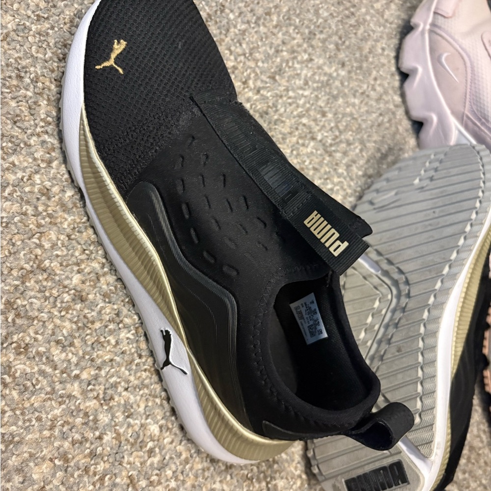 Puma Black and Gold Athletic Shoes